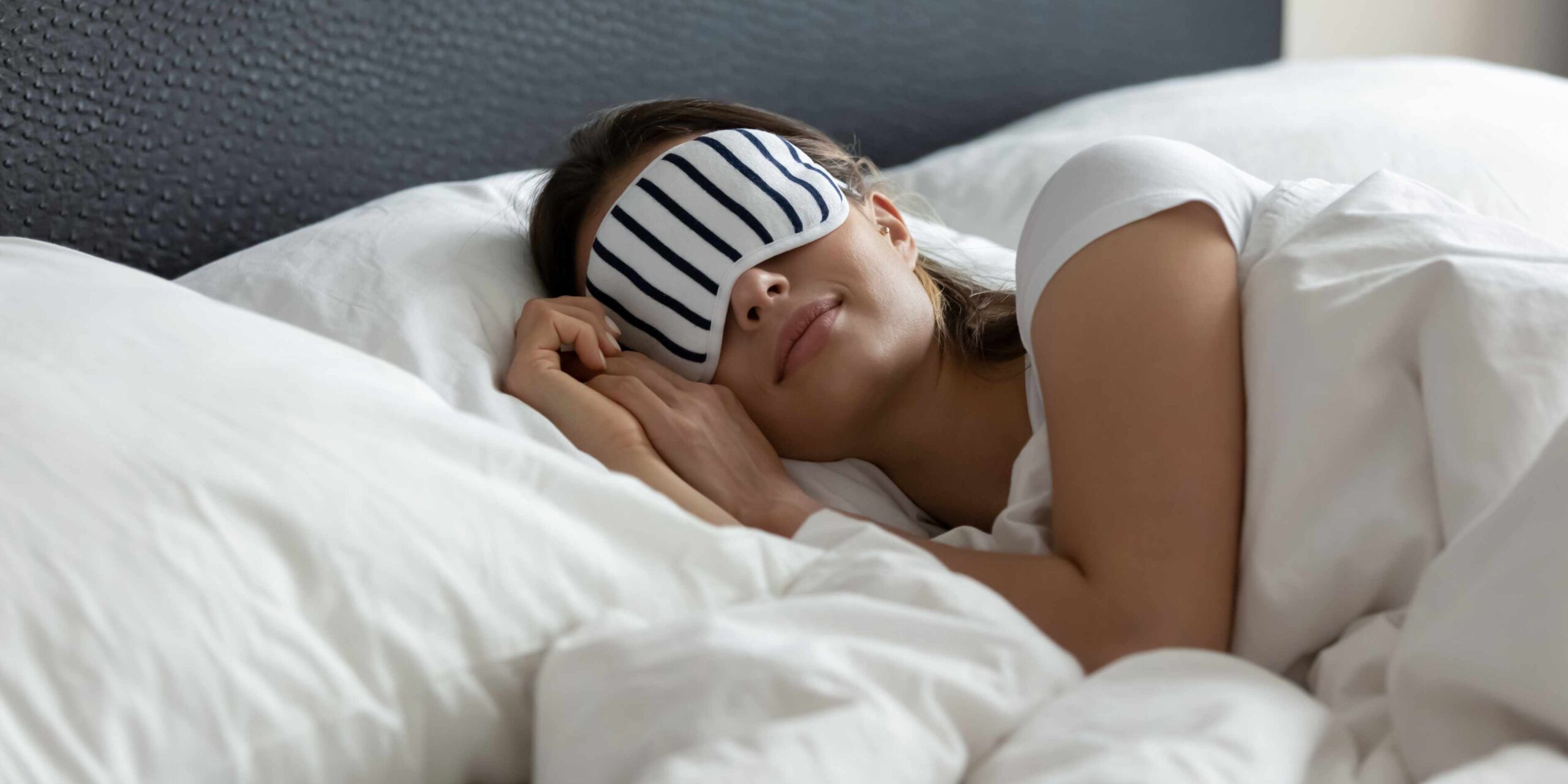 Woman asleep with eye mask for better sleep