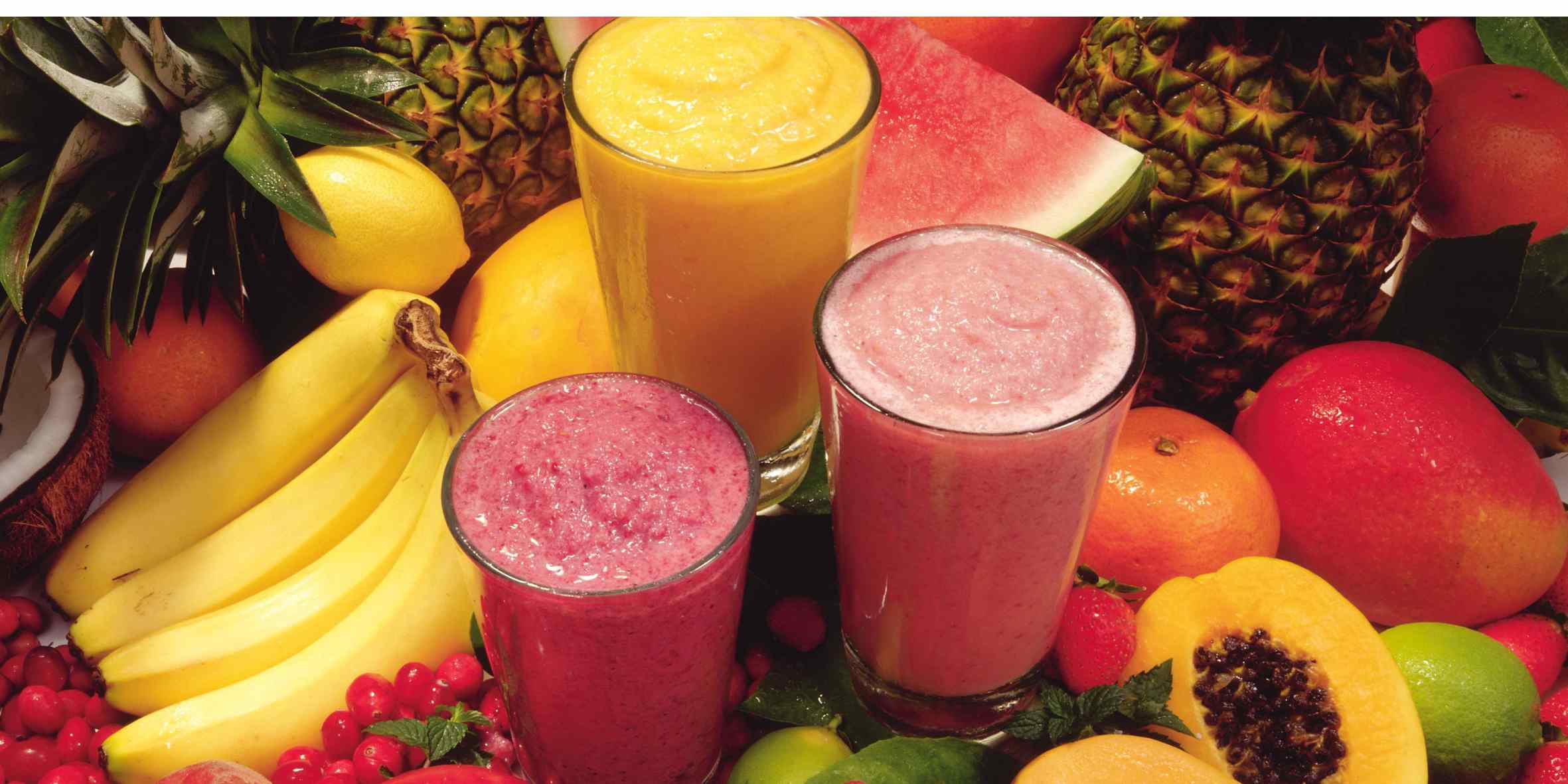 Smoothies surrounded by fruit